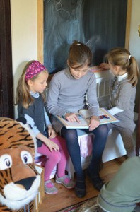 Children reading photo by Spigoo 